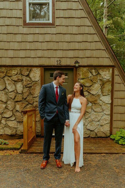 couple outside cabin wedding