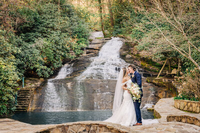 Bride & Groom kiss in front of waterwall,  North GA Mountain Wedding, Chota Falls, Georgia Waterfall Venues.