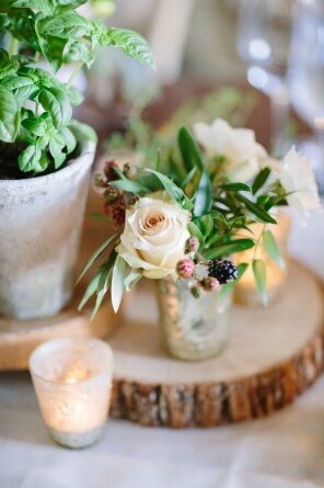 table center pieces of flowers and candles