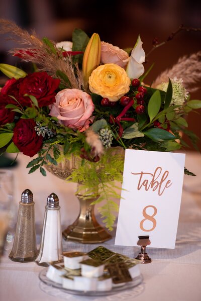 Picture of flowers and table number card - UME (New England Wedding Planners were part of day)