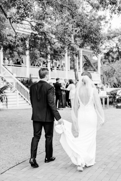 Bride & Groom walking to reception at the Creek Club at I'on