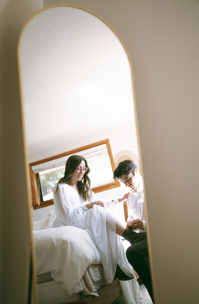 colorado elopement photography in breckenridge, bride and groom getting ready at airbnb