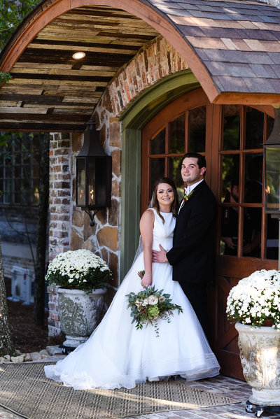 Couple in front of Greengates Farmhouse in Laural, MS