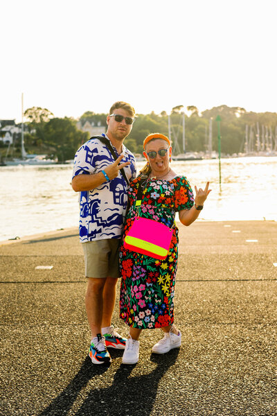 A fun, sunset portrait of Paul + Kel wearing very bright colours whilst on holiday in Bénodet, France.