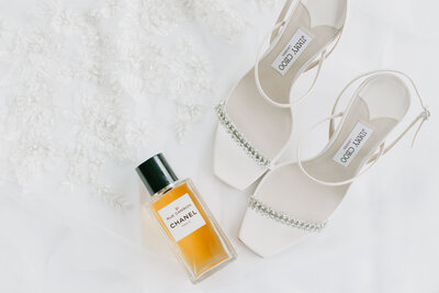 wedding day flatlay styling with shoes and perfume