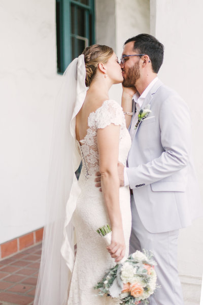 Bride kisses groom after elopement at Santa Barbara Courthouse