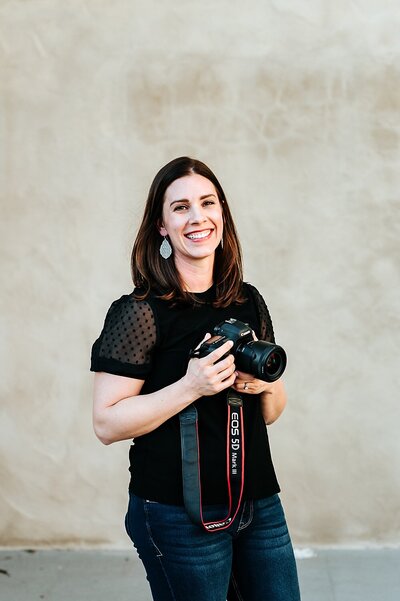 photographer holding camera