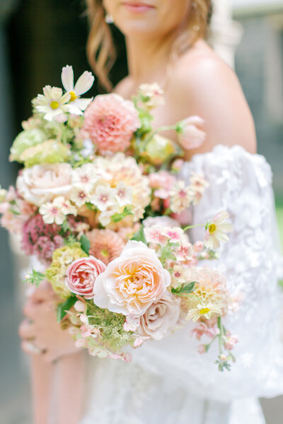 lush spring bridal bouquet sweet pea, roses, ranunculus Rooted in Flora