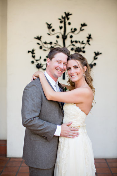 Bride and Groom hugging at ceremony site at The Darlington House San Diego wedding venue
