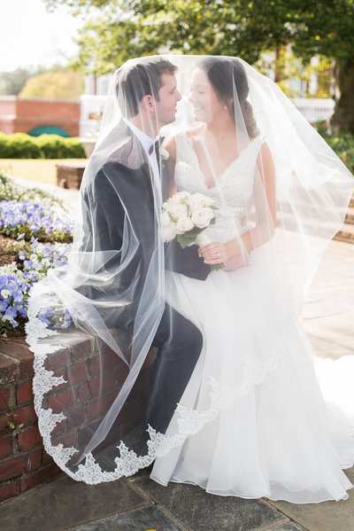Bride and Groom under veil