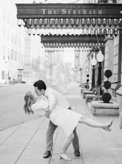 Bride and groom dip and kiss in downtown Louisville photographed by Lexington Kentucky film wedding photographer Magnolia Tree Photo Company