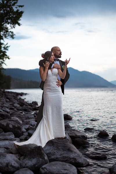 lake shore elopement couple at sunset in montana