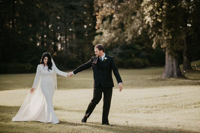 Bride and Groom walk hand in hand following their Little Rock Arkansas Wedding