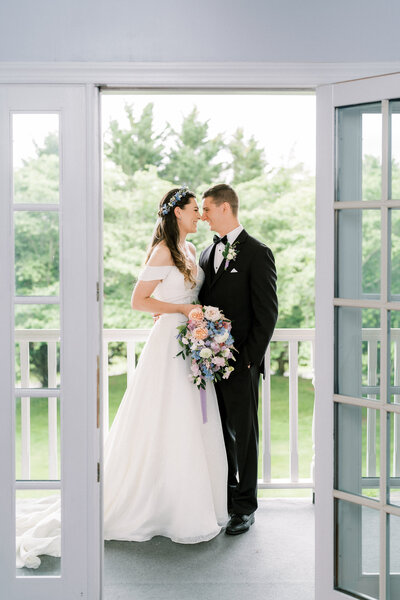 couple standing in doorway on their wedding day
