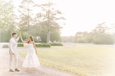 Couple twirls at sunset celebrating their recent engagement in Slidell, LA.
