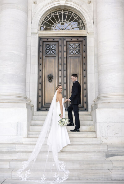 Image of Bride and Groom outside of the  DAR Constitution Hall this wedding was planned by Washington Wedding Planner Blue Sapphire Events