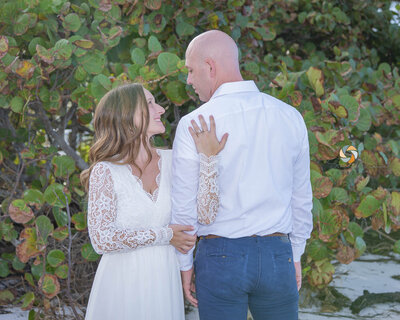 man and woman on a beach eloping