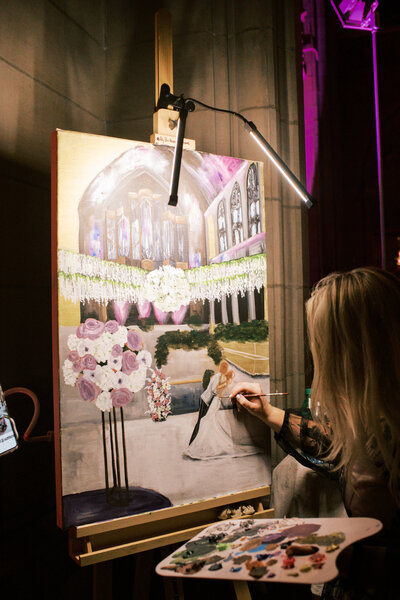Live painter Brittany Branson captures a bride and groom during their wedding reception in Cleveland Ohio