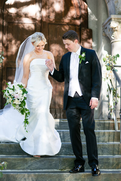 bride and groom laughing on their wedding day