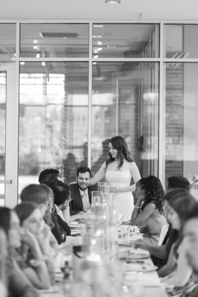 Candid Photos in the reception area at Downtown Market – West Michigan wedding photographer.