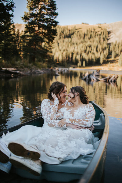 elopement photos of women in boat on lake