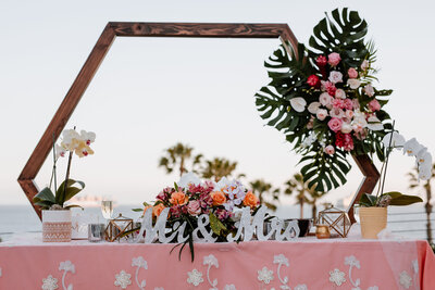 hexagon wedding altar with tropical table