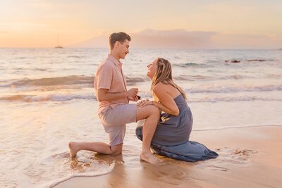 Man proposing to his fiancee on the beach in Maui, Hawaii