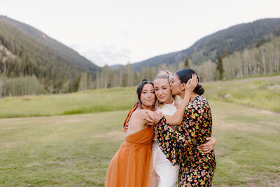 bride hanging out with friends at denver colorado wedding