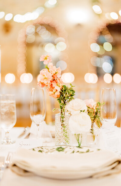 Elegant table decor with tropical centerpieces and candles at a Central South Florida wedding reception.