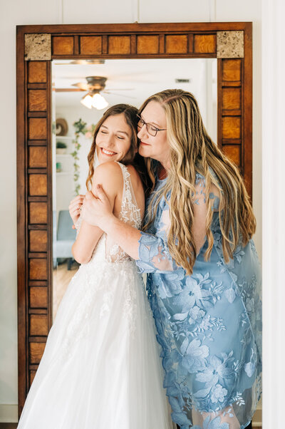 Palm Beach Wedding Photographer captures mom hugging daughter who is about to get married