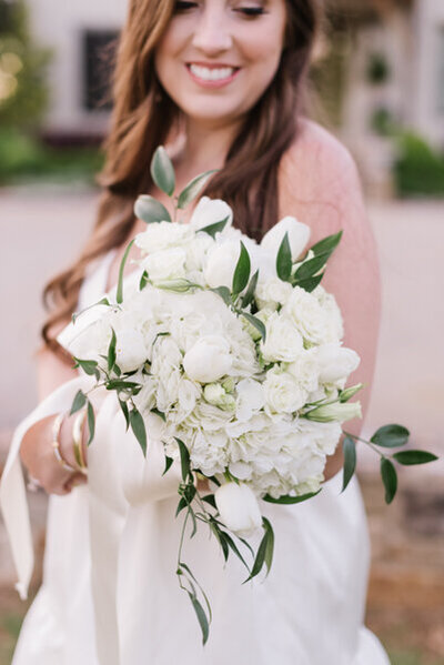 Dan Clay Farms Spring Wedding Bride holding an all white bouquet