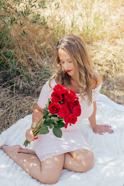 keri nola with a bouquet of roses