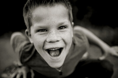 young boy gives a big smile for the camera in The Colony, Texas