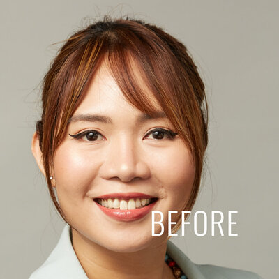 Smiling woman headshot before light Photoshop.