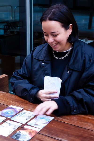 Personal Branding photo of woman reading oracle cards
