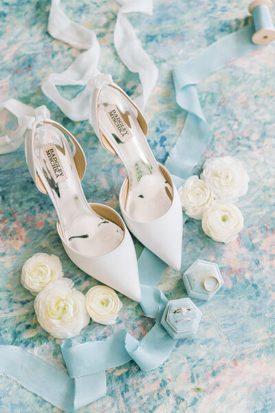 Blue and white flay lay details for a springtime Savannah wedding.