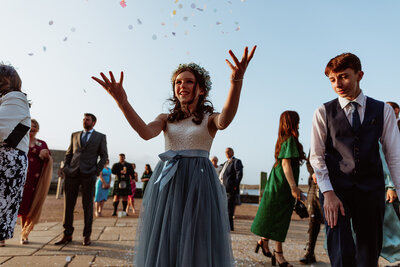 children throw cofetti
