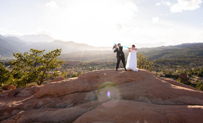 Golden hour elopement portrait with glowing red rocks and natural light at Garden of the Gods