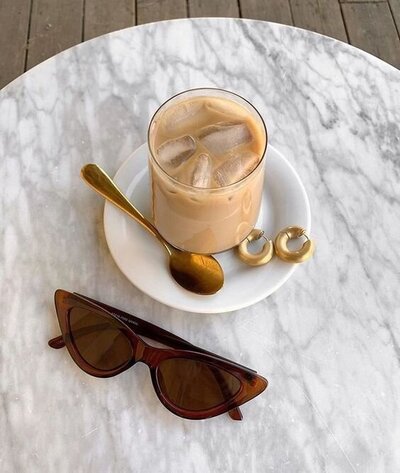 Cup of iced coffee on top of marble table