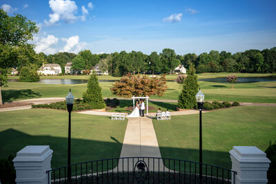 Wide-angle-portrait-of-black-couple-eloping-at-Providence-Country-Club-showcasing-the-golf-course