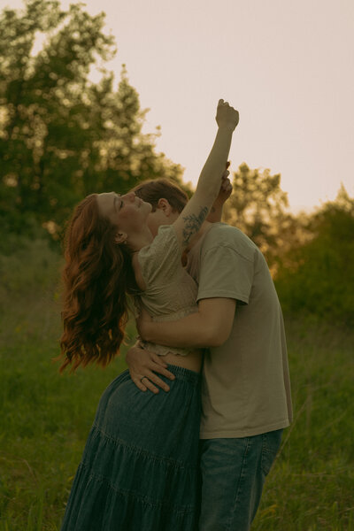 A couple sits atop the Z-lot in Detroit during a dreamy evening date night