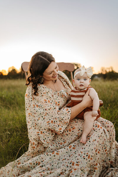 mom and baby sitting on rocking chair
