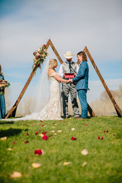 bride and groom standing outdoors during jackson hole outdoor ceremony