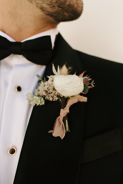 Groom & Boutonniere - Bre & Chris | Converted Basketball Court Wedding – Featured in Brides Magazine