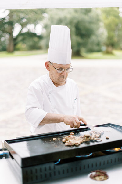Chef cooking at wedding chateau in Bordeaux