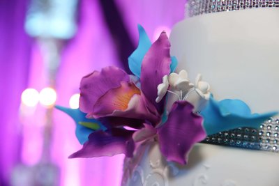 Close up of purple sugar flower on wedding cake. Photo by Ross Photography, Trinidad, W.I..