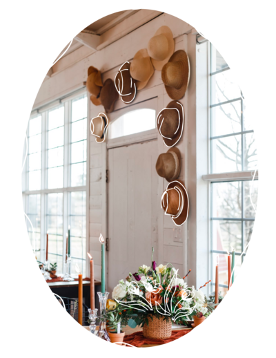 Bridal shower with hat display wall and florals for social event planning
