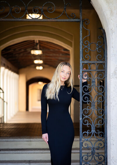 Senior photo shoot of blonde girl at Rollins College in Winter Park, FL
