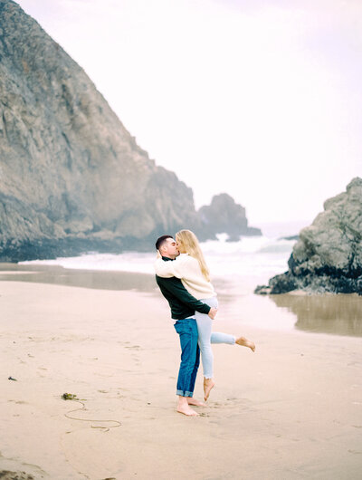 couple posing on beach in san francisco, san francisco ocean beach engagement, half moon bay engagement session, san francisco photographer
