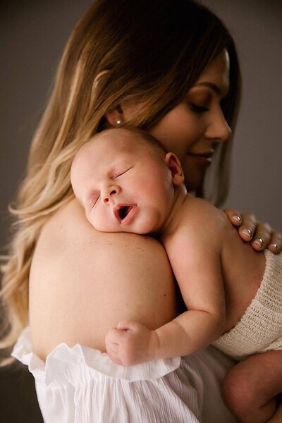 A mother holding a newborn baby